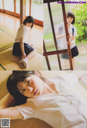 A woman laying on the floor next to a window.