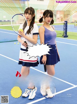 A group of young women playing tennis on a court.