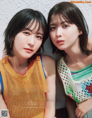 A magazine spread with a picture of two young women dancing.