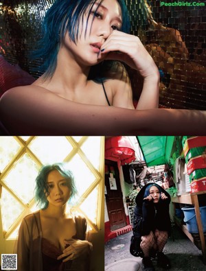 A woman with blue hair sitting on a bed.