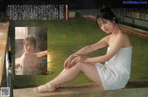 a woman in a blue top and denim skirt posing for a magazine